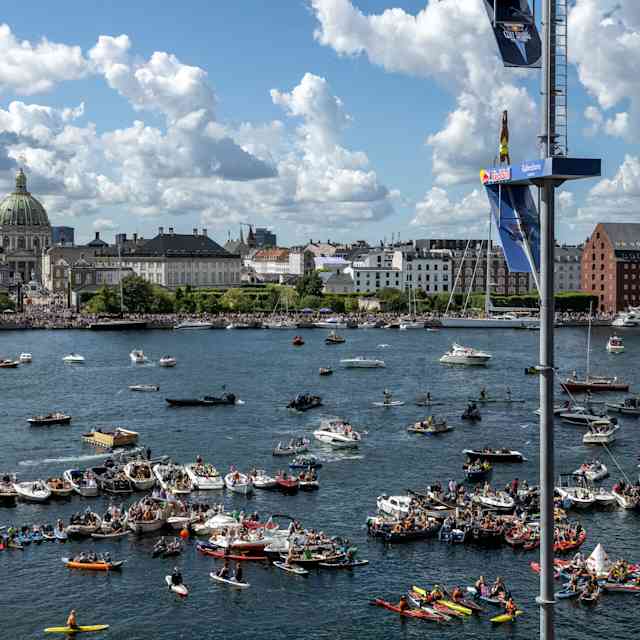 Ukrainian diver Antonina Vyshyvanova performs an armstand dive from 21.5 metres at the Copenhagen Opera House during the thrilling 2022 Red Bull Cliff Diving World Series event