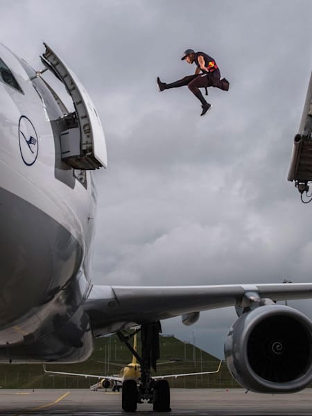 Forerunner Jason Paul makes a huge leap into an airliner at Munich Airport, Germany whilst filming his movie Last Call For Mr Paul