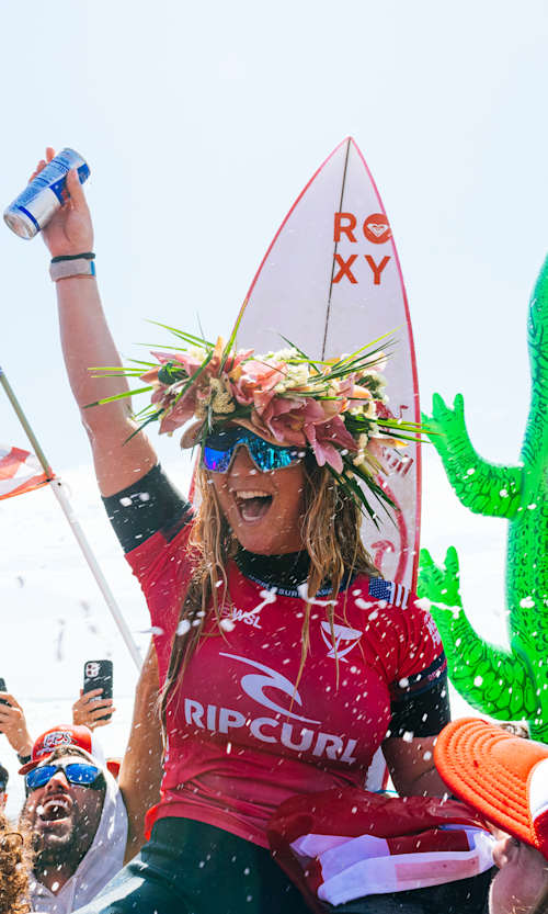 Caroline Marks and her Floridian cheer squad on the beach at Lower Trestles in California