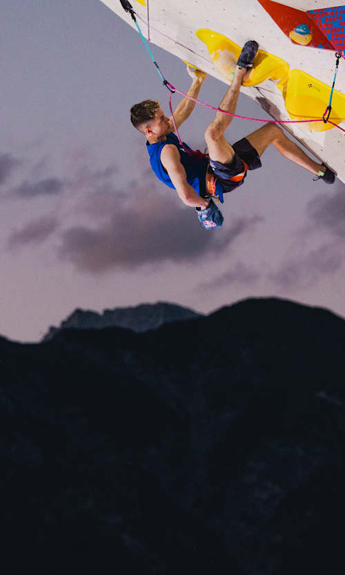 Toby Roberts defies gravity on the overhanging wall during the 2025 IFSC Lead Climbing Semi Finals in Innsbruck, Austria.