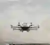 An autonomous passenger drone flies above Guangzhou, China.
