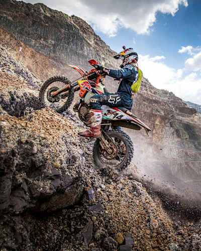 Enduro champion Manuel Lettenbichler climbs a hill.