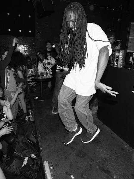 A photo of footwork originator RP Boo doing a footwork dance at the 2014 Red Bull Music Academy Festival New York.