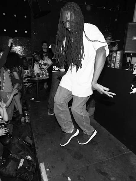 A photo of footwork originator RP Boo doing a footwork dance at the 2014 Red Bull Music Academy Festival New York.