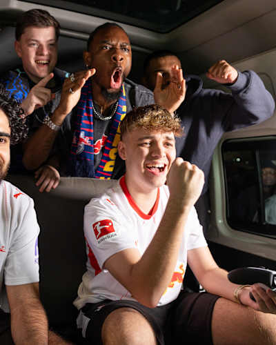 Umut 'Umut' Gültekin, Donovan 'Tekkz' Hunt and Alfie 'RedLac' Calder celebrate during a game of EA FC at Red Bull Diski Last Namba in Johannesburg, South Africa in May 2026.