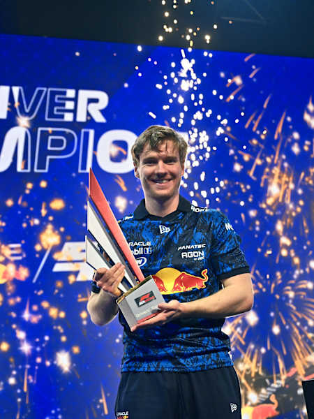 Jarno Opmeer lifts the trophy for Oracle Red Bull Sim Racing at the 2025 F1 Sim Racing World Championship on 27 March, 2025 