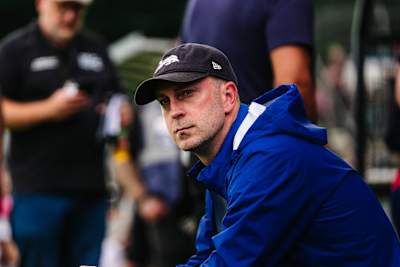 Ole Werner with cap and rain jacket on the touchline.