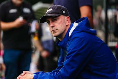 Ole Werner with cap and rain jacket on the touchline.