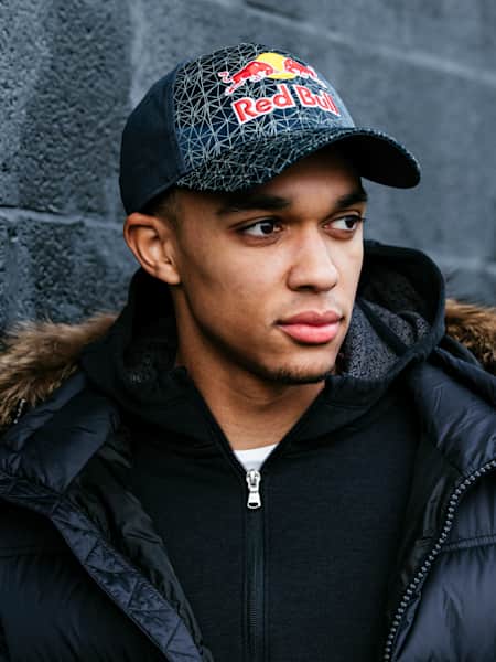 An image of footballer Trent Alexander-Arnold in Red Bull hat.