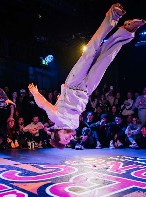 B-boy Aleon claims the title at the 2025 Red Bull BC One Cypher Ireland Final, showcasing gravity-defying moves at the Button Factory in Dublin
