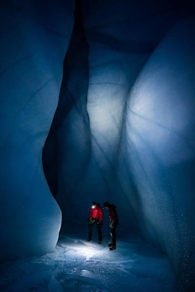 Will Gadd and another climber use their headtorches to look at the ice during Gadd's trip to explore the Greenland ice cap in 2018.