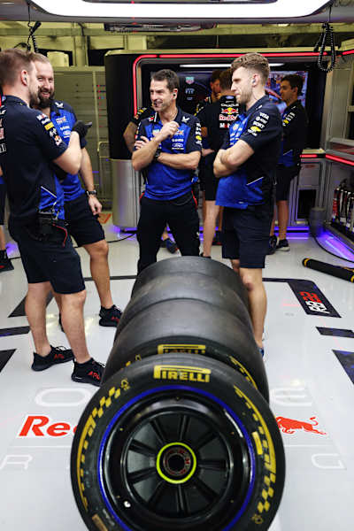 Oracle Red Bull Racing team members talk in the garage during day two of F1 Testing at Bahrain International Circuit on February 12, 2026 in Bahrain