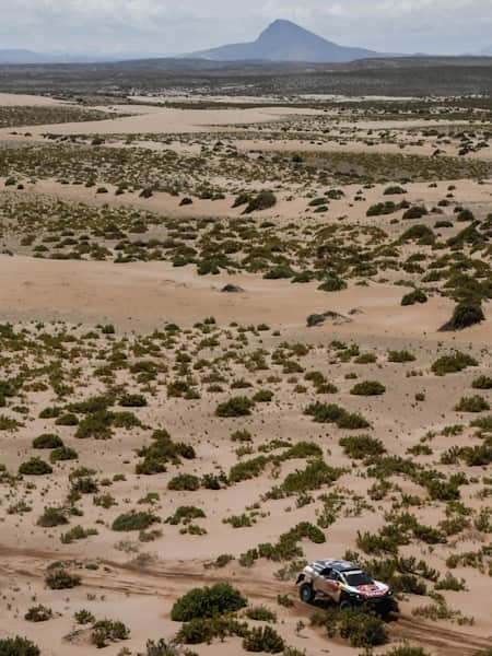 A photo of rally-raid drivers Carlos Sainz and Lucas Cruz in their Peugeot 3008 DKR Maxi during stage eight of the Dakar Rally in Bolivia.