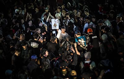 Leony is surrounded by fans and presents the trophy