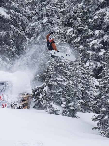 Ben Ferguson performs a grab during his qualifying run at Natural Selection Tour 2025 in Revelstoke, Canada.
