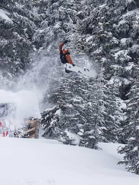 Ben Ferguson performs a grab during his qualifying run at Natural Selection Tour 2025 in Revelstoke, Canada.