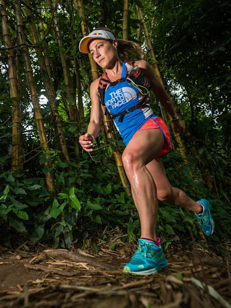 An athlete runs through a jungle during ultramarathon race in Colombia.