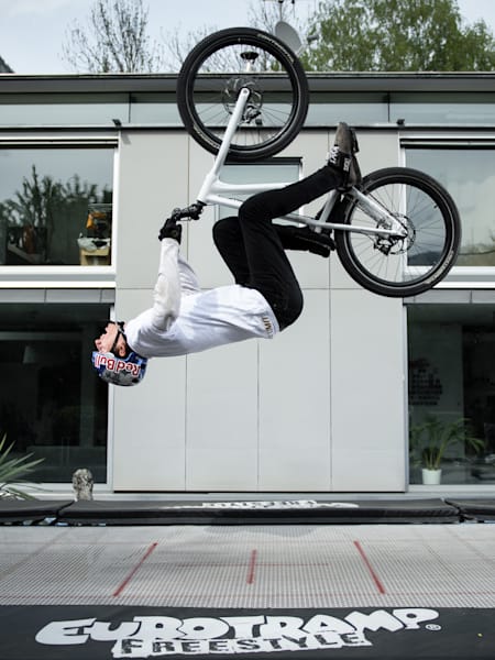 MTB trials rider Fabio Wibmer Backflips on his trampoline during filming of his video Home Office.
