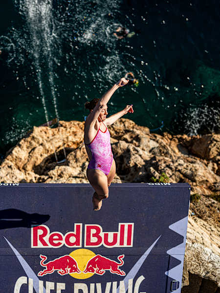 Molly Carlson launches into an epic dive from the 21m platform, knowing that years of training and muscle memory conditioning will guide her boy intuitively through 3 seconds of insane aerial action