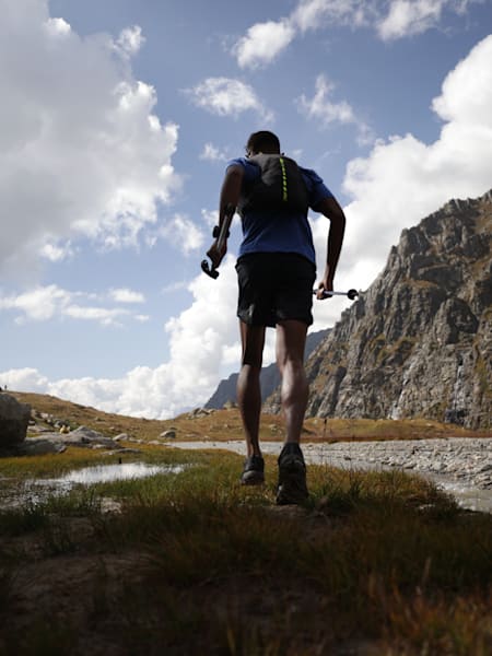 Kieren D'Souza runs by a stream on his way to scaling Mount Deo Tibba in the Himalayas.