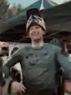 A screenshot from On Track featuring a laughing Greg Callaghan after the Crankworx event.