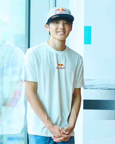Sorato Anraku poses for a portrait phot in branded Red Bull gear.