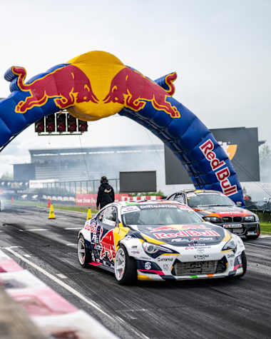 Conor Shanahan and Pontus Hartman ignite the track at Round 3 of 2025 Drift Masters in Alahärmä, Finland, under the iconic Red Bull archway