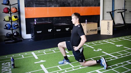 Ice hockey player Dominik Kahun stretches his hip at the FT Club Munich.