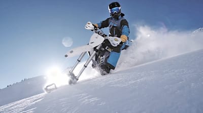 Darren Berrecloth rides a snowbike to practice for Red Bull Rampage.