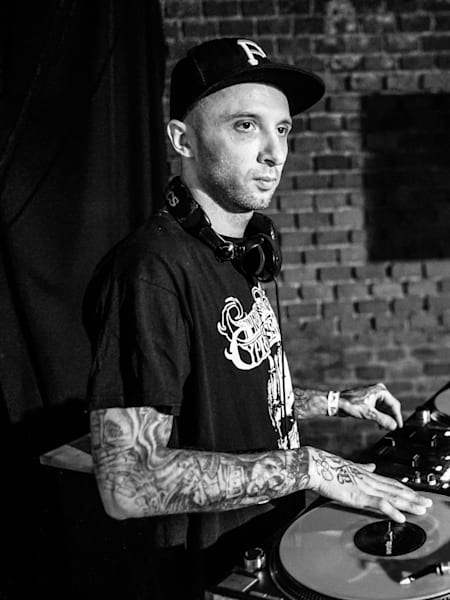 A DJ at the decks at the afterparty from BC One Cypher Krakow