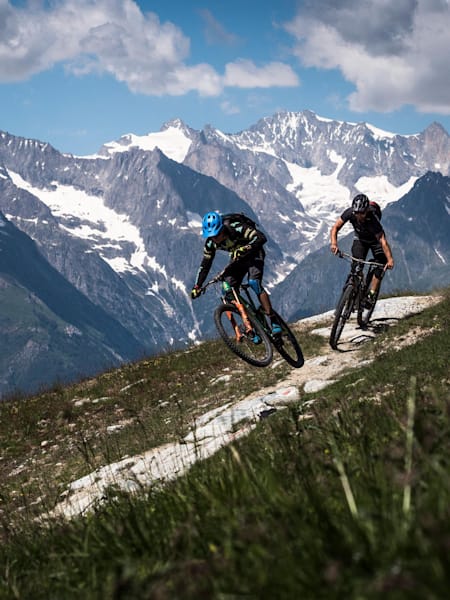 MTB riders Ludo May and Yann Guigoz begin the descent from Hannnigalp to Graechen on June 26, 2018.