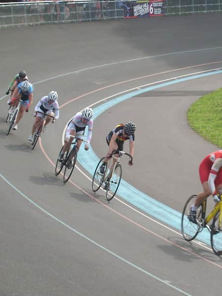 Photo of riders going arounf the Herne Hill Velodrome in London.