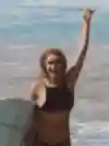Ivy Miller – surfer, comedian, model and star of Instagram – poses for a portrait with her board in Mexico.