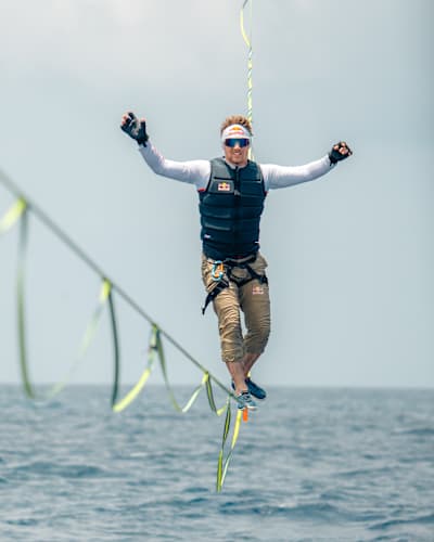 On May 10, 2025, Jaan Roose balances on a slackline between a parasail and boat over the stunning waters of the Maldives.