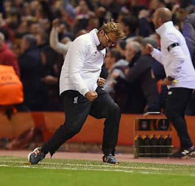 Jürgen Klopp celebrates Liverpool's 4-3 victory against Borussia Dortmund at Anfield.