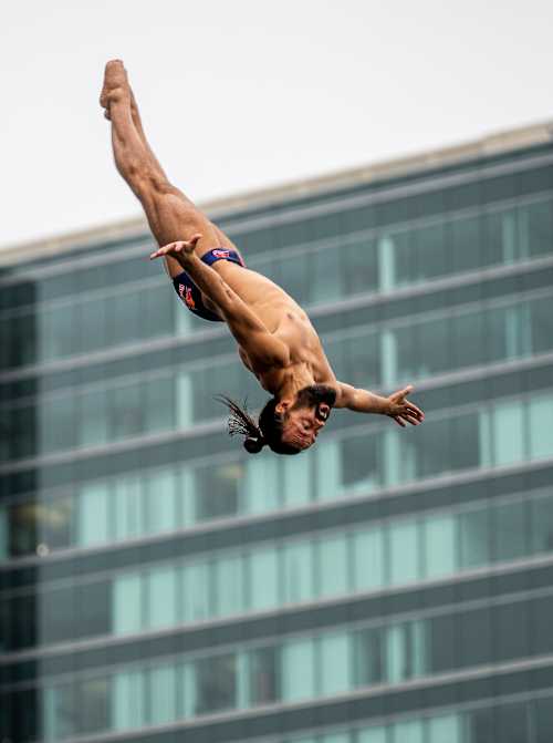 Cătălin Preda of Romania executes a dramatic dive from the 27 metre platform during training for the Red Bull Cliff Diving World Series final in Boston, USA, on September 18, 2025