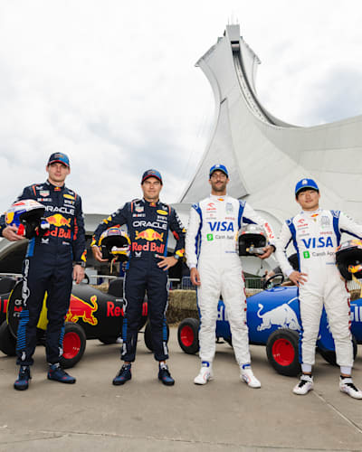 The drivers posing in front of their custom soapbox
