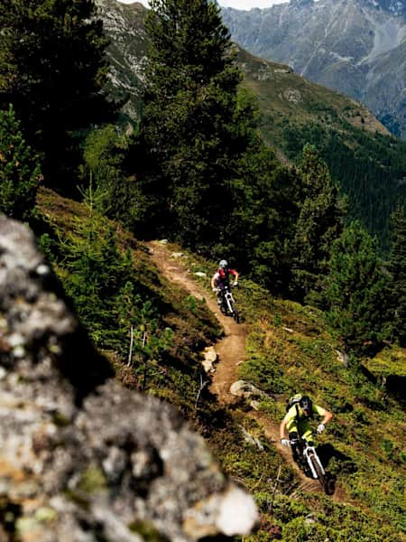 Holger Meyer and Karen Eller weave their way through single track in Sölden, Ötztal, Austria.