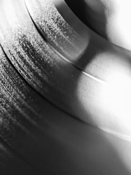 A black and white photo of a vinyl record.