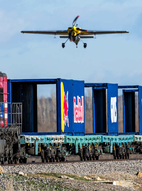 Dario Costa carefully approaches a train in his Zivko Edge 540 in Afyonkarahisar, Turkey, as he attempts to land on and and take off from a moving cargo train in February 2025.