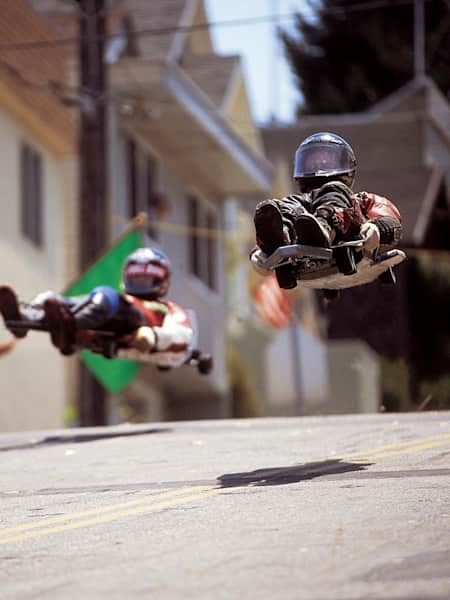 Participants race at the 2002 Streets of San Francisco street luge contest.