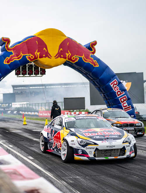 Conor Shanahan and Pontus Hartman ignite the track at Round 3 of 2025 Drift Masters in Alahärmä, Finland, under the iconic Red Bull archway