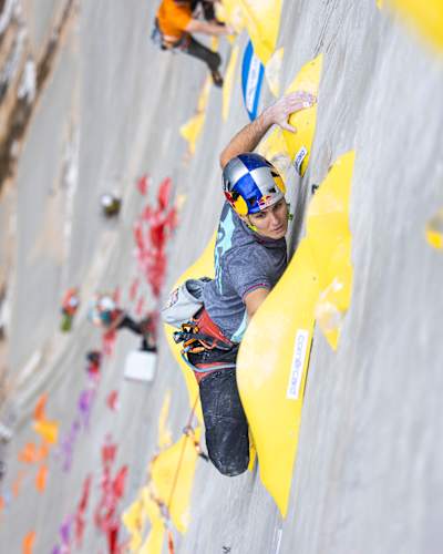 In 2023, Domen Škofic climbs the Red Bull Dual Ascent wall on the Verzasca Dam in Switzerland