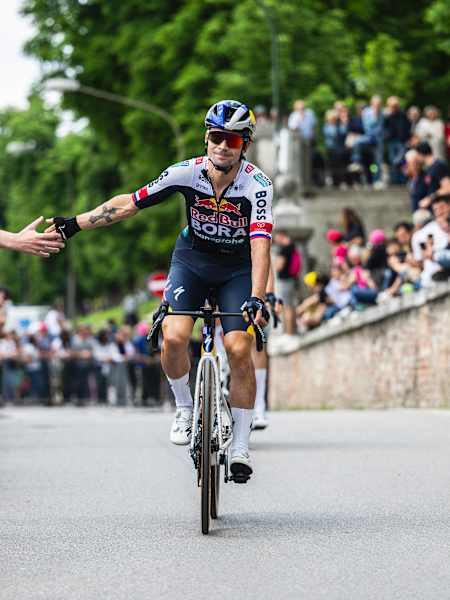Primož Roglič of Red Bull - BORA - hansgrohe connects with fans during the Giro d'Italia in Treviso, Italy, on May 24, 2025.