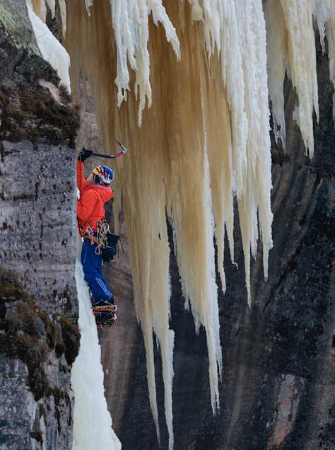 An image of climber Sasha DiGiulian climbing ice in Michigan, USA.