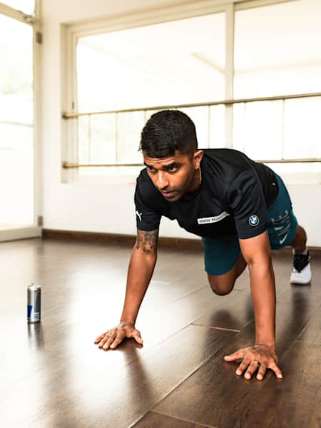 Fitness man doing exercises on the floor