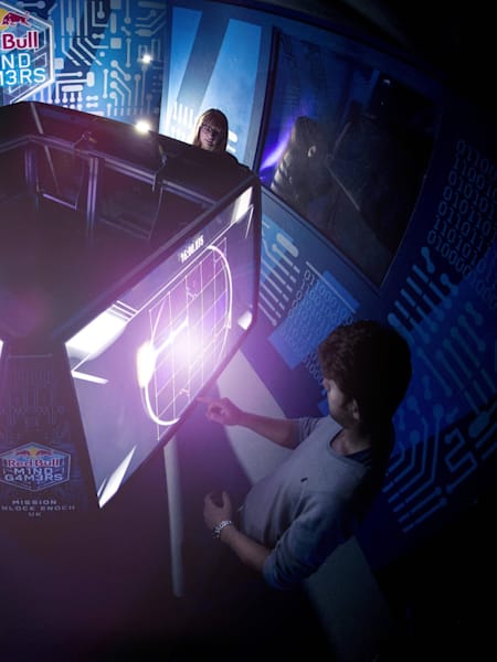 Participants competing on electronic machines at one of the Red Bull Mind Gamers in the UK