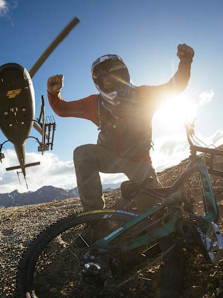 Brage Vestavik and his mountain bike being dropped by the Helicopter in Sutton, Alaska, USA on July 16, 2024,