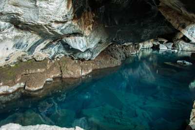 The lake can be found in a small lava cave