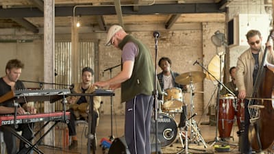 A photo of UK jazz crew Tenderlonious and the 22archestra performing live for Red Bull Music.